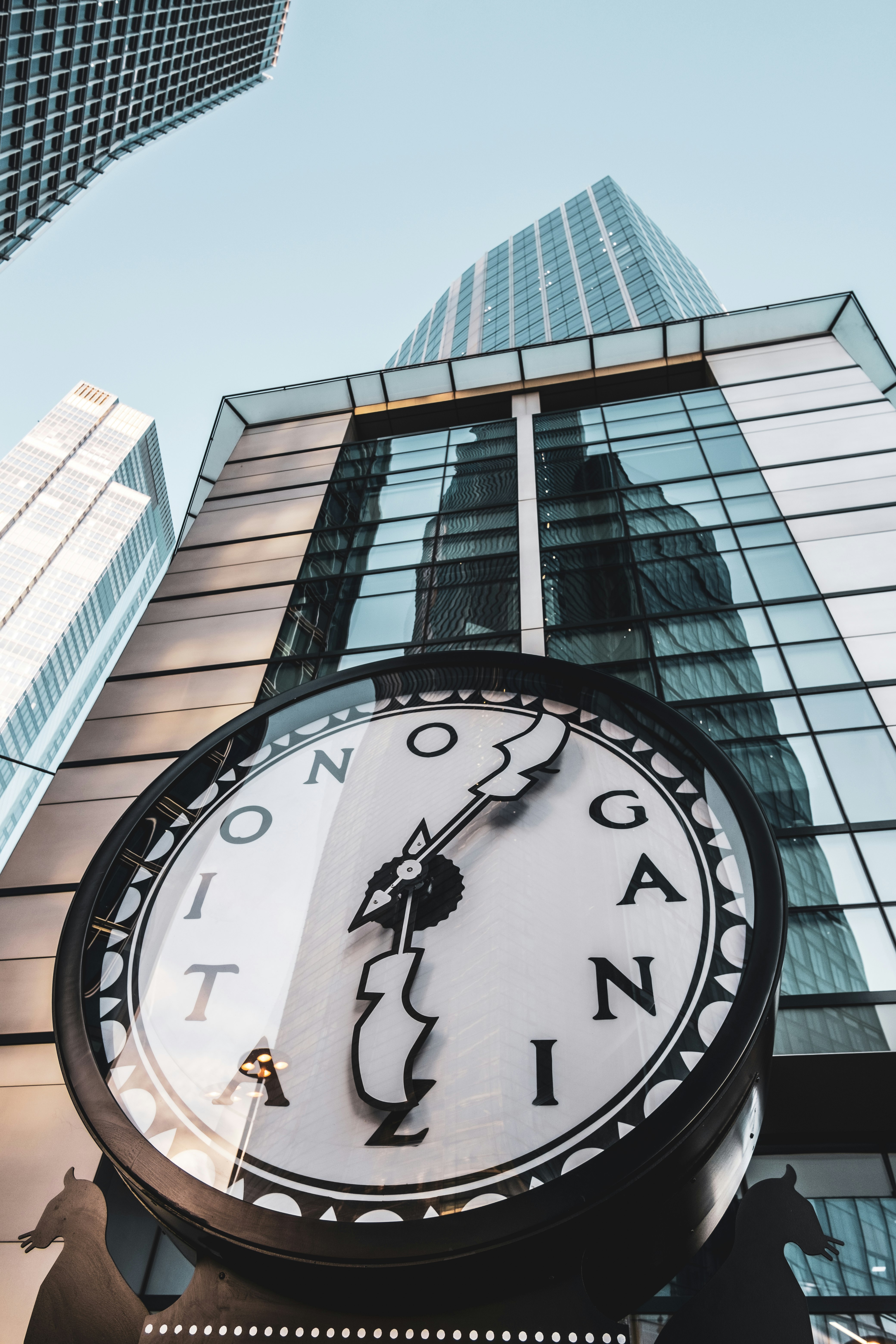 black and white analog clock at 10 00